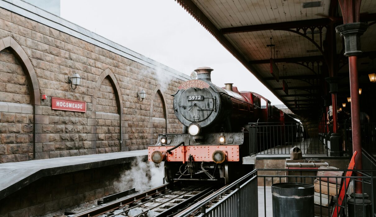 red and black train on rail tracks during daytime