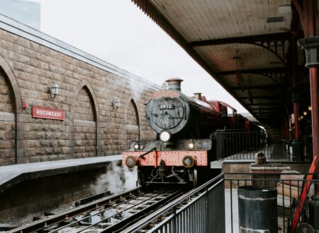 red and black train on rail tracks during daytime