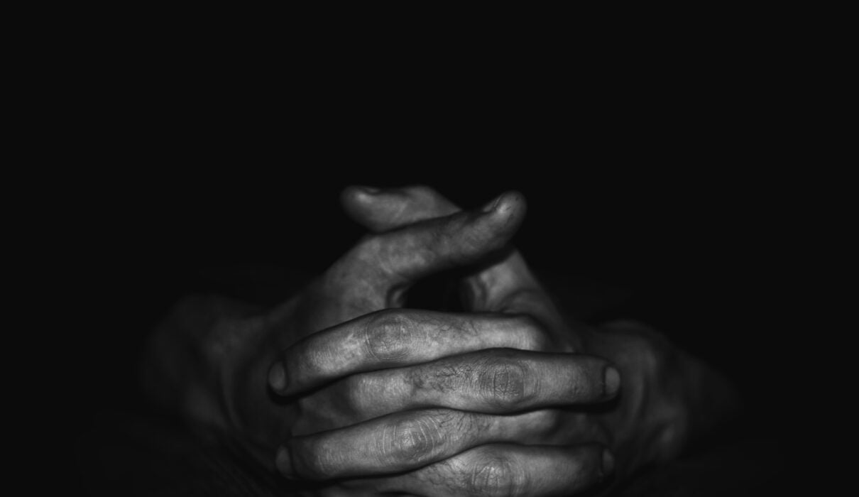 grayscale photo of persons hand