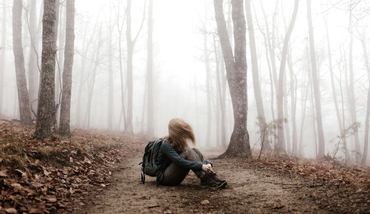 woman sitting on land