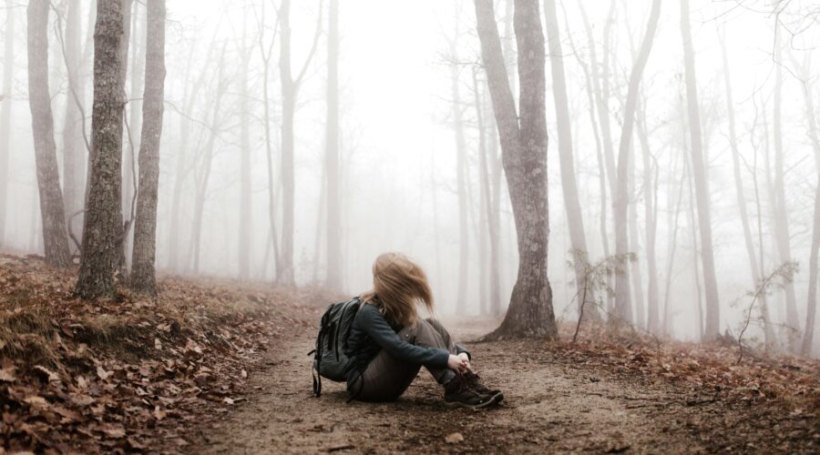 woman sitting on land