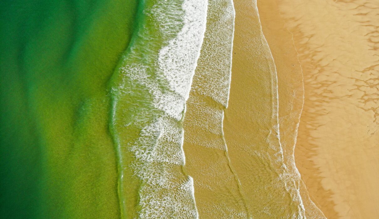 a bird's eye view of a sandy beach