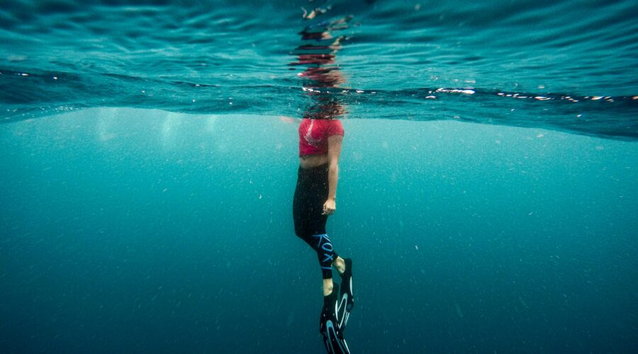 photography of person under water