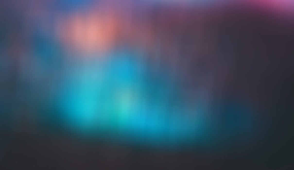 a blurry image of a blue and pink background