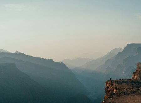 a person standing on top of a cliff