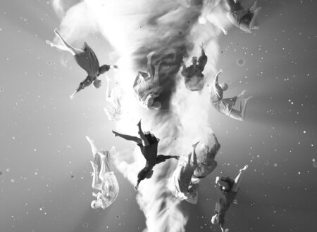 a black and white photo of birds flying in the sky