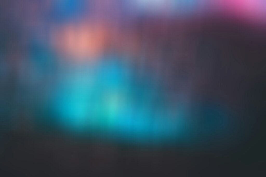 a blurry image of a blue and pink background