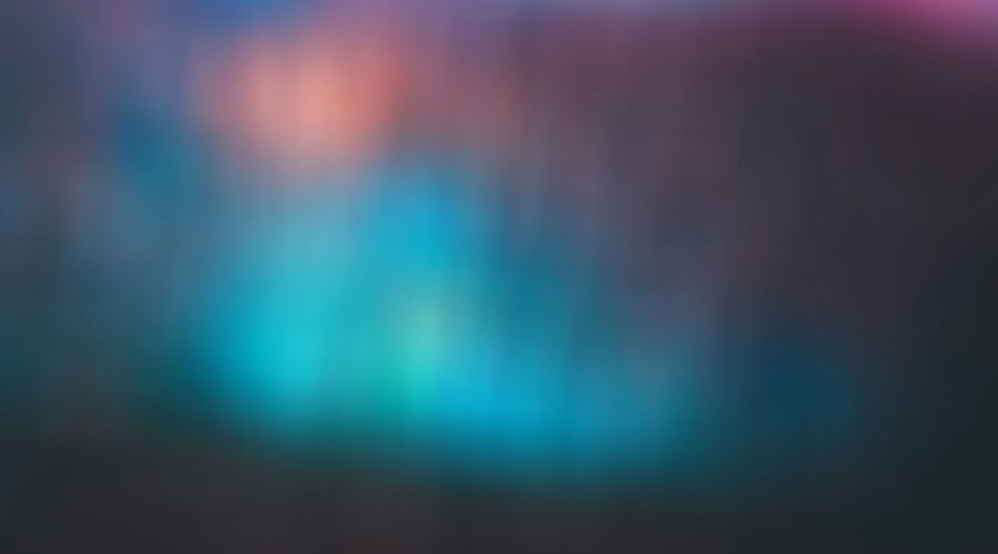 a blurry image of a blue and pink background